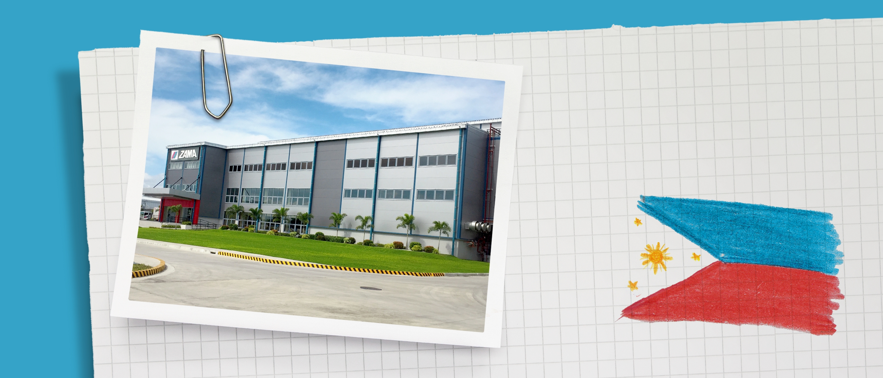 Ein graues Geb&auml;ude mit ZAMA-Schriftzug.